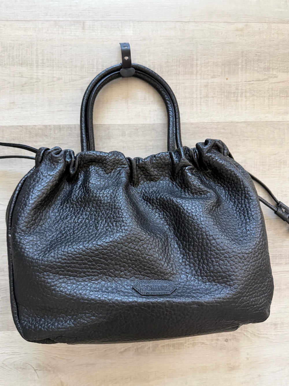 SCHUTZ Black Pebbled Leather Drawstring Tote Bag